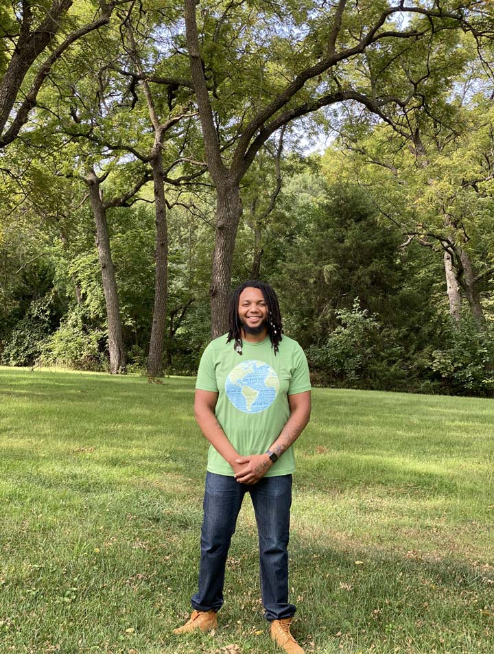 photo of love beyond color founder chris mccullough in a park by the trees